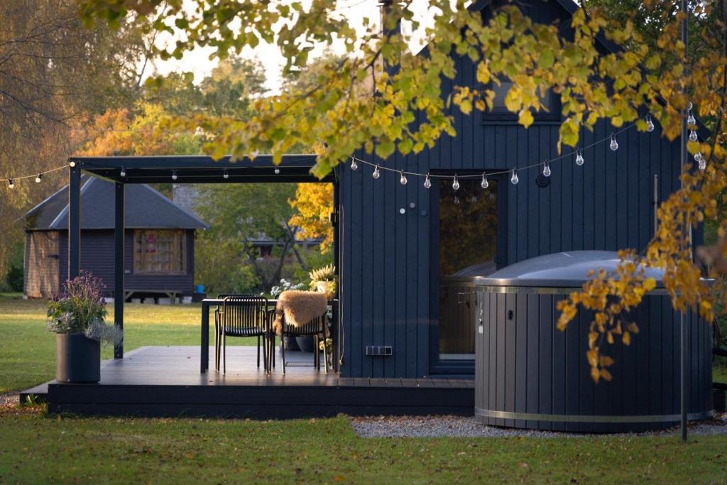 MyCabin modular home with a covered terrace and outdoor hot tub