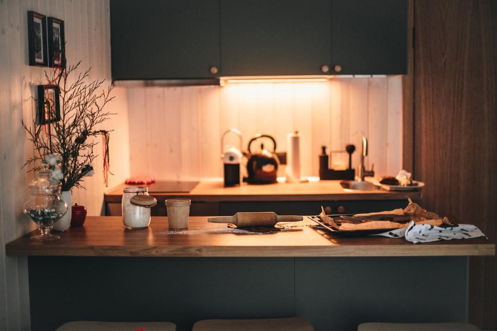 Warm MyCabin kitchen with dark cabinetry and wood finishes