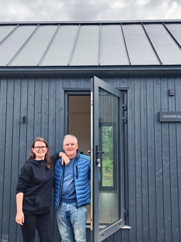 MyCabin homeowners at their open front door