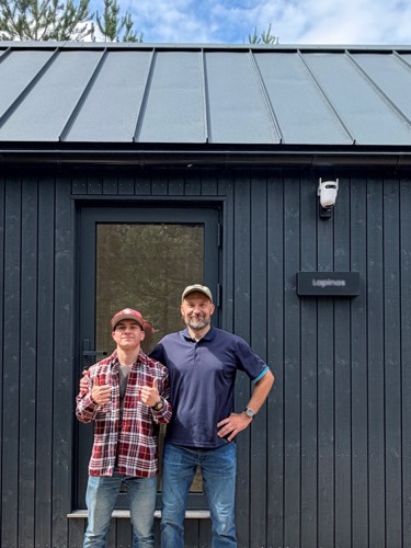 MyCabin homeowner and his son outside their new home