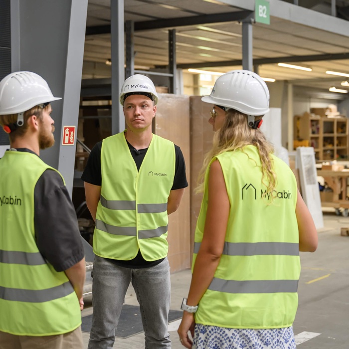 The MyCabin team discussing a build at the factory