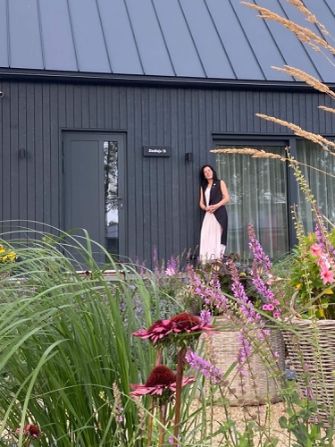 Client outside the entrance of their Milla 25